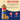 Torani Cupcake syrup bottle with ingredients list on a beige and blue background