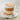 Cappuccino in a glass cup on a marble surface