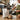 Person preparing coffee in a cafe with a bag of chocolate hazelnut cappuccino mix and a cup of coffee.