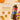 A bottle of Torani Pumpkin Pie Syrup displayed on a warm beige promotional background with pumpkin illustrations, syrup text, and feature callouts.